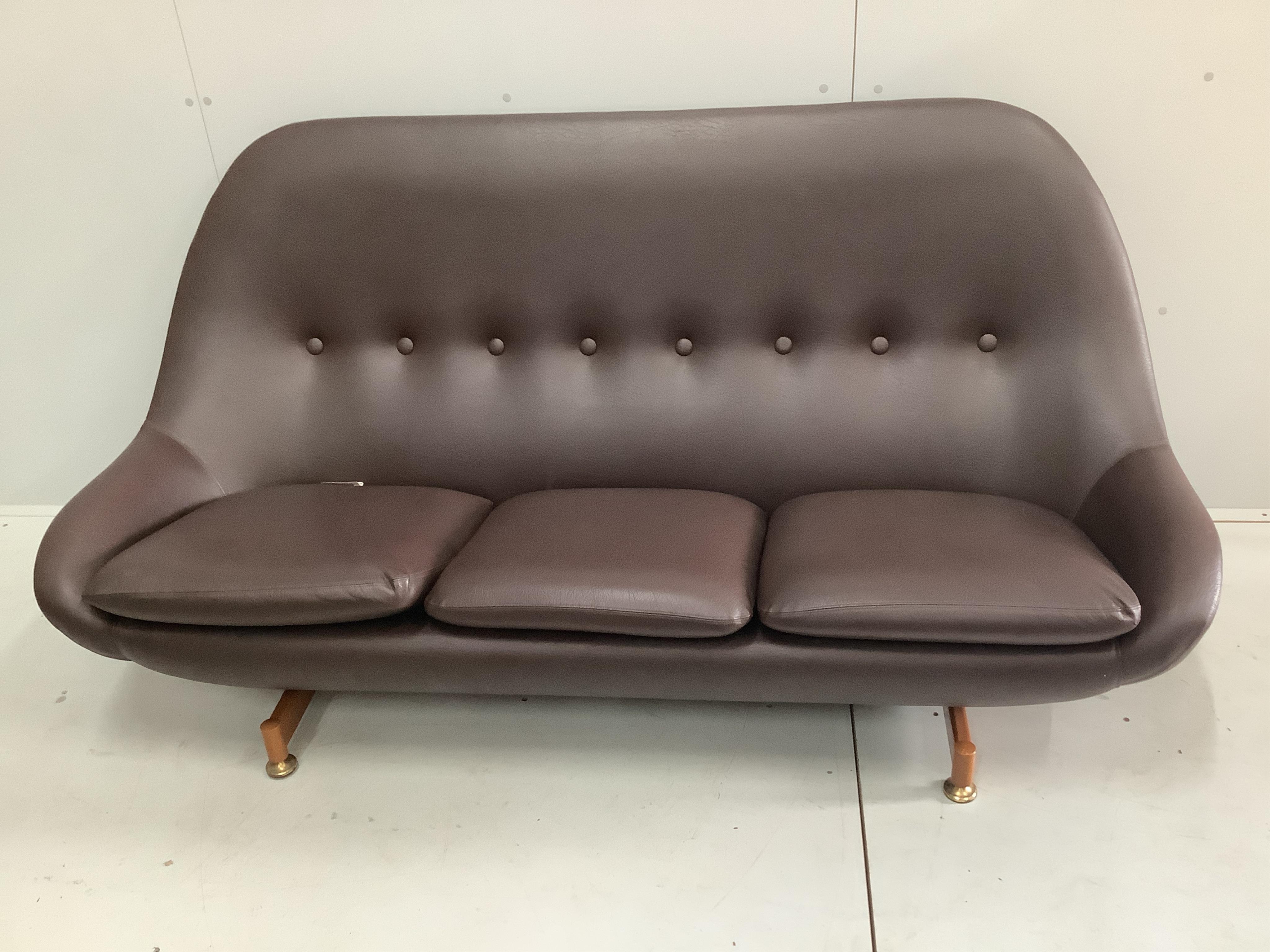 A Greaves & Thomas three piece leatherette suite, settee width 180cm, depth 66cm, height 88cm. Condition - good